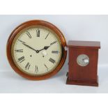 An early 20th century mahogany cased circular wall clock with 12" dial set with Roman numerals,