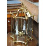 A modern brass concave hexagonal hall lantern, height (excluding ceiling attachment) 54cm.