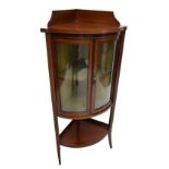 An Edwardian mahogany and inlaid bowfronted corner display cabinet,