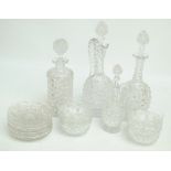 A clear cut glass set including bottle decanter, cylindrical decanter, a ewer,