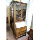 An Edwardian mahogany and inlaid bureau bookcase of small proportions,