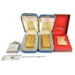 Two Dunhill 'Rollagas' gold plated lighters, a Dupont example,