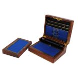 A Victorian leather travelling writing slope with hinged lid enclosing a fitted interior stamped