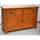 A contemporary oak sideboard, one central long drawer,