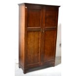 A mid-20th century mahogany two-door cupboard, 166 x 100cm.