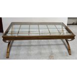 A large gilt metal framed and glass-topped coffee table, 127 x 71cm.