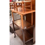 A c1930 oak two-tier tea trolley on castors, two small rush-seated stools,