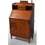 An Edwardian mahogany Rhind & Sons of Manchester bureau of asymmetrical design,