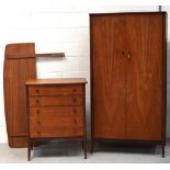 A teak Waring & Gillows bedroom set comprising a teak curved double headboard,