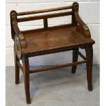 A Shoolbred & Co oak stool/piano stool, low back and brass-mounted decoration, width 54.5cm.