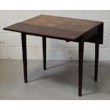 A Georgian mahogany drop-leaf dining table on tapering square supports, width when extended 101cm,