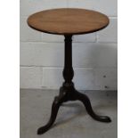 A 19th century mahogany circular lamp table raised on tripod supports, diameter 51cm, height 70cm.