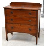 A 20th century oak bow-front chest of drawers with three long drawers, on legs and castors,