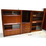 A retro wall unit comprising three matching separate units,