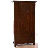 An early-to-mid 20th century Arts and Crafts style oak wardrobe,