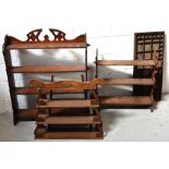 An oak four-shelf open bookcase with carved frieze,