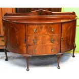 An early 20th century reproduction mahogany bow-front sideboard,
