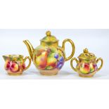 A small Royal Worcester fruit painted teapot and cover,