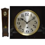 A 1920s oak cased eight day chiming longcase clock, with bead decoration,