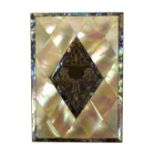 A Victorian mother of pearl card case with lozenge shaped decoration and central engraved white