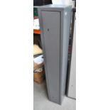 A grey painted steel gun cabinet with internal hinge and two separate locks by Gunsafe UK with