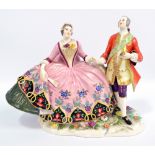 An early 20th century Dresden porcelain figure group depicting gentleman and his companion,