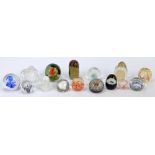 A collection of fifteen glass paperweights to include four cane work decorated and two Caithness