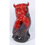 A large Royal Doulton flambé veined glazed figure of seated owl, marked to base,