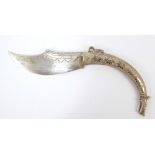 A 19th century continental white metal skinning knife with shaped blade and curved body with