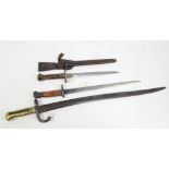 Three Dutch bayonets; 1873 Beaumont, 1895 and 1895 cavalry, one with scabbard (3).