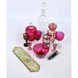 A small group of clear and ruby glass to include a small decanter with a pair of matching tot