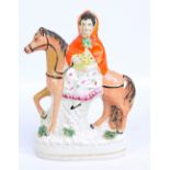 A mid-19th century Staffordshire figure 'Little Red Riding Hood', classed as very rare,