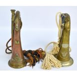 Two bugles with cords and tassels, one for Royal Artillery, the other stamped C. A.