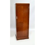 A 1930s slim linen press with slides and drawers.