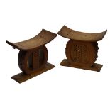 A near pair of African Ashanti stools, width 50cm.