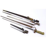 Four socket bayonets, one with leather scabbard, two with metal scabbard, one lacking scabbard,