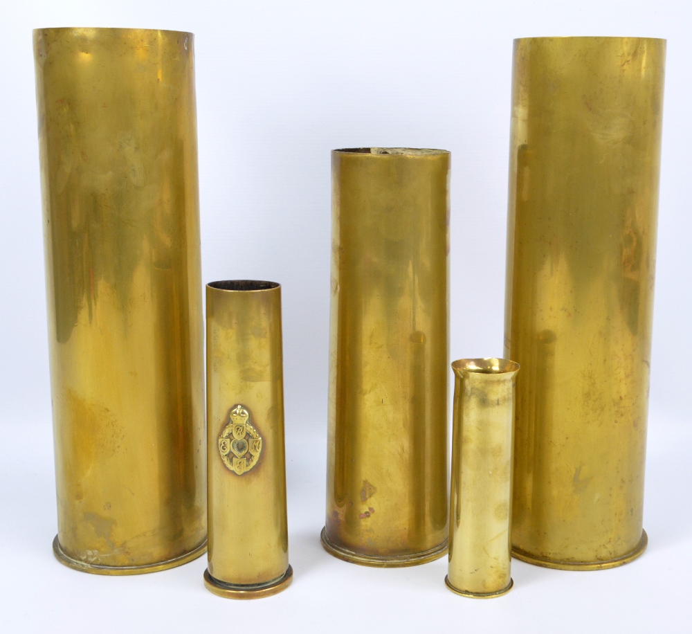Five brass shell cases, largest 37cm, smallest 15.