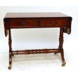 A reproduction mahogany sofa table.