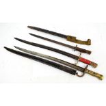 Two French Chassepot bayonets, one with scabbard, length 71cm and a further Enfield 1907 example,