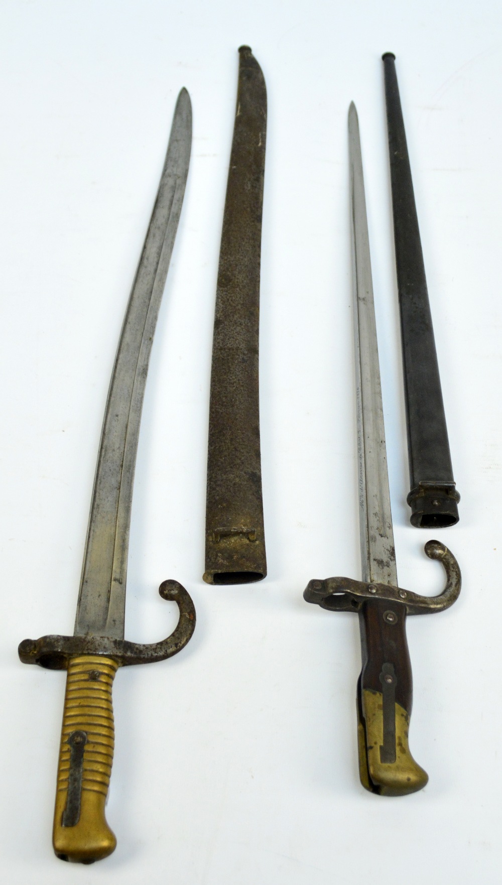 Two 19th century sword bayonets, the larger stamped J 13988 to quillon and scabbard,