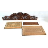 A foliate scroll carved oak ex-furniture piece with central crest, length 111cm,