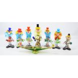 Seven Murano glass clowns, the tallest 36cm, and a dish in the form of a gondola, length 37cm (8).