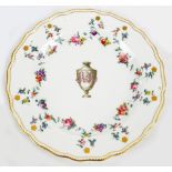 A late 18th century Derby porcelain shaped circular cabinet plate painted with urn to the centre