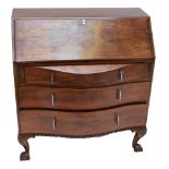 A 1930s walnut bureau with three serpentine graduated drawers raised on cabriole legs to paw feet,