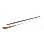 A late 19th century bamboo sword stick with tapering blade set with a section of stylised