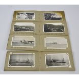 Four small photograph albums containing black and white military related photographs,