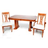 A mahogany and crossbanded extending dining table of rectangular form with canted corners,