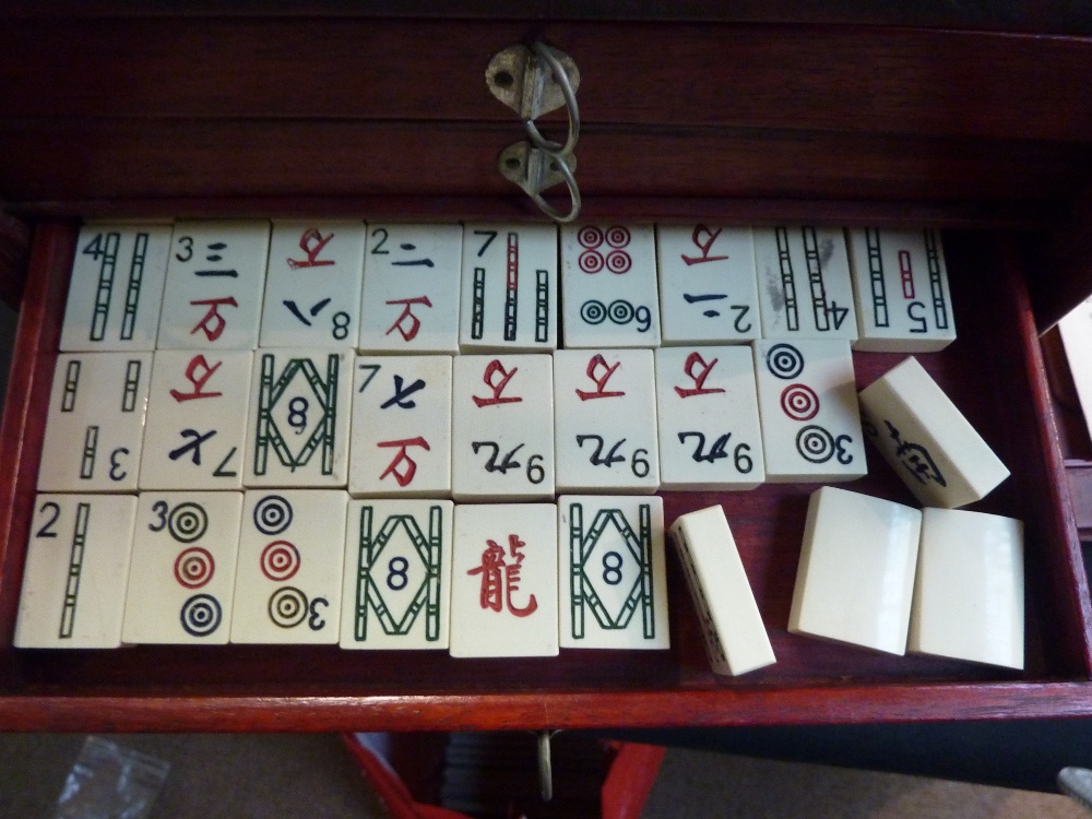 A Mahjong set contained within a five drawer cabinet, pink tiles made of simulated bone, - Image 2 of 2