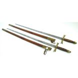 Two ceremonial brass and leather handled swords, blades stamped 'Verch & Flothow Charlottenburg',