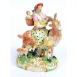 An early 19th century pearlware figure 'Tailor's Wife Upon a Goat',